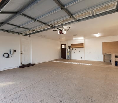Spacious garage with room for parking, storage, and projects. This Sun City home offers convenience and additional functional space.
