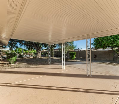 Shaded patio area ideal for relaxing or entertaining outdoors. This Sun City home features low-maintenance yard space and outdoor comfort.