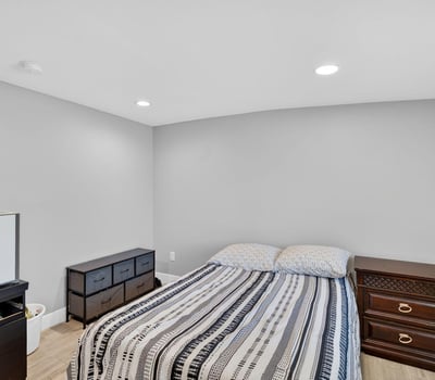 Comfortable guest bedroom with clean finishes, modern flooring, and flexible layout options.