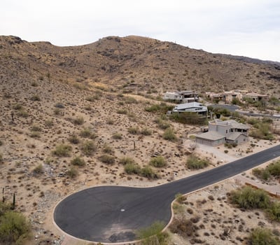 Exceptional hillside lot bordering protected preserve land, offering privacy, scenic desert terrain, and direct access to hiking and biking trails. A rare opportunity to build surrounded by untouched natural beauty.