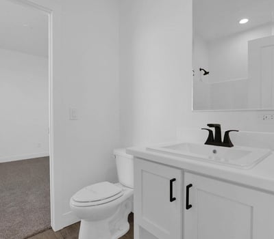 Stylish Jack-and-Jill bathroom with modern finishes, sleek fixtures, and practical access between adjoining bedrooms. An ideal setup for family living while maintaining privacy and convenience.