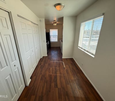 Bright dining space accented by large windows and attractive flooring. Conveniently positioned between the living area and kitchen, it creates an ideal flow for daily living and entertaining.