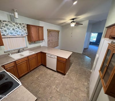 Spacious kitchen with abundant cabinet storage, generous prep areas, and an efficient layout designed for convenience. The open design enhances functionality while maintaining a welcoming atmosphere.