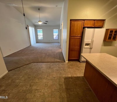 Open kitchen overlooking the spacious living area, creating excellent flow throughout the home. The functional layout encourages gathering, entertaining, and comfortable day-to-day living.