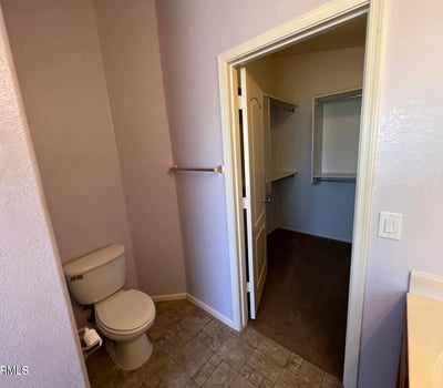 Functional primary bath with convenient access to a spacious walk-in closet. This efficient design enhances organization while providing a seamless owner's suite experience.