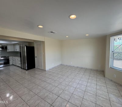 Spacious dining area adjacent to the updated kitchen with ample room for formal or casual dining. Natural light and an open layout enhance the home's flow and functionality.