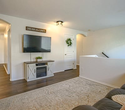 Flexible upstairs loft with updated flooring and generous space for a media room, game room, study area, or additional family room. An excellent bonus space that adapts to your lifestyle.