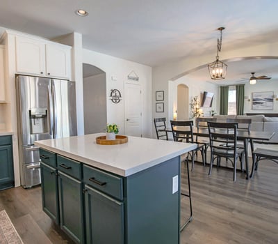Welcoming front entry featuring upgraded stair flooring, modern finishes, and an open layout that showcases the home's spacious design and thoughtful renovations.