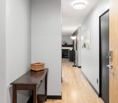 Bright and inviting hallway featuring modern finishes and ample natural light, with easy access to living spaces.