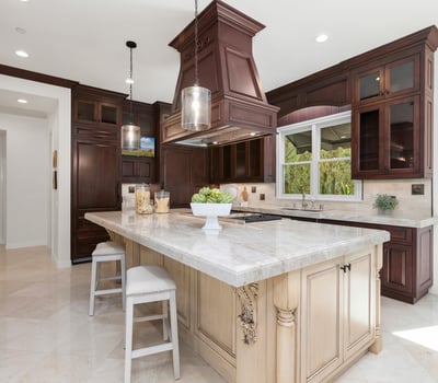 Discover a stunning kitchen featuring rich cabinetry, a spacious island, and modern appliances, perfect for entertaining.
