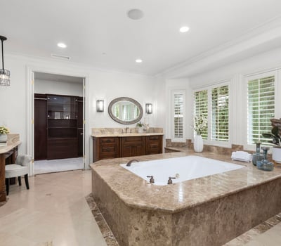 Primary Bathroom -Spacious bathroom featuring a luxurious soaking tub, spacious walk in shower, TV, Toto Neocrest Toilets and a beautifully crafted vanity area. (TV included)