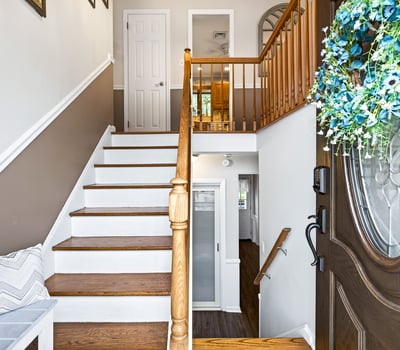 Welcoming entry with staircase up to main rooms.