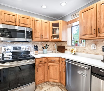Efficient kitchen with SS appliances.