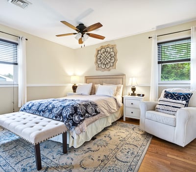 Serene primary bedroom with natural light.