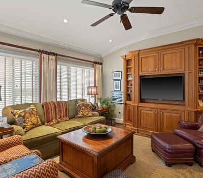 200-year-old milled pine cabinetry from the Green River area near Asheville extends into the informal sitting area