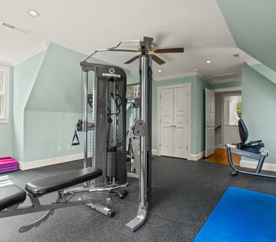 Detached garage has 6th bedroom in the upstairs apartment currently used as a home gym, and ensuite bath