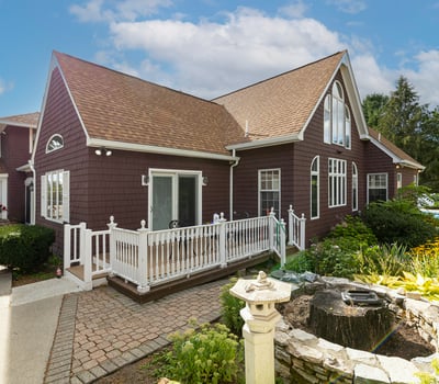 Discover this inviting home with a spacious design, lush gardens, and a refreshing pool area.