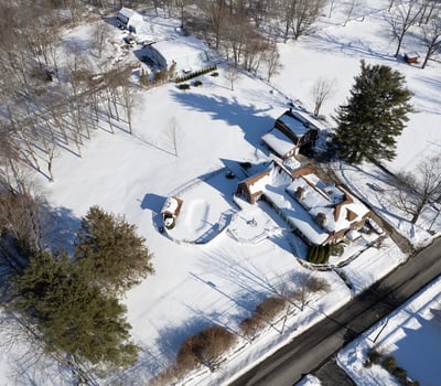 Discover a spacious property with expansive outdoor areas, surrounded by winter wonderland views and tranquility.