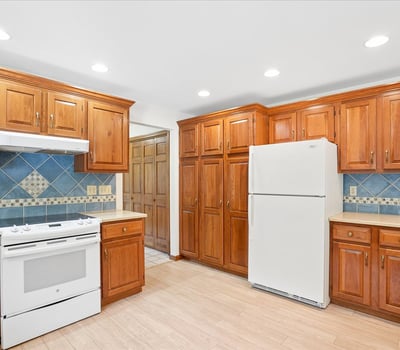 Discover a bright kitchen featuring ample cabinetry, modern appliances, and a functional layout perfect for cooking.