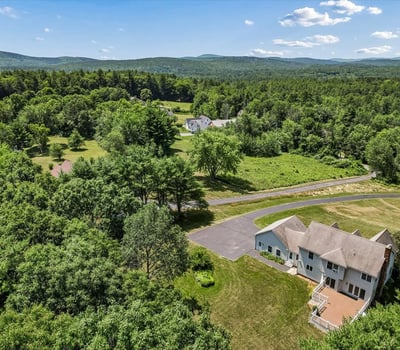 Spacious home nestled in lush greenery, offering panoramic views and ample outdoor space for relaxation.