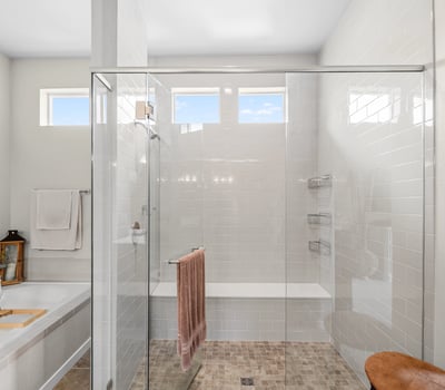Primary Suite with attached 5 piece bath and walk in closet.