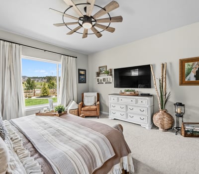 Primary Suite with attached 5 piece bath and walk in closet.