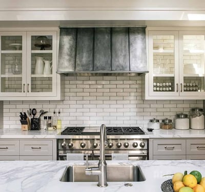Modern kitchen featuring sleek cabinetry, stainless steel appliances, and elegant marble countertops, perfect for culinary enthusiasts.
