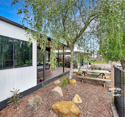 This property features a modern home surrounded by landscaped outdoor spaces ideal for entertaining and relaxation.
