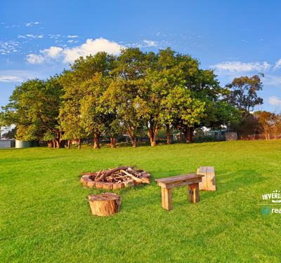 Expansive outdoor space featuring a cozy fire pit area, perfect for gatherings and relaxation.