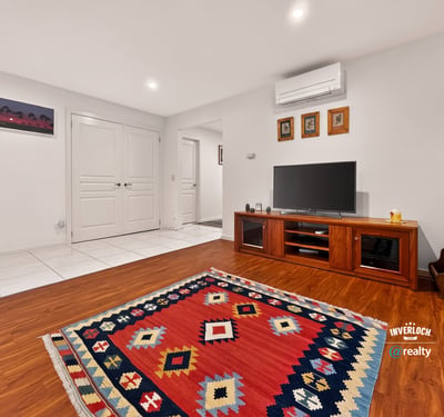 Bright and welcoming living space featuring modern amenities, vibrant decor, and versatile layout for comfort.