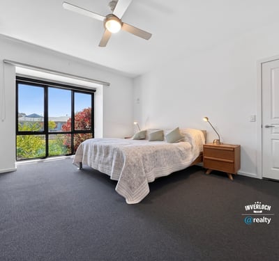 Bright and airy bedroom with large windows, offering stunning views and ample natural light.