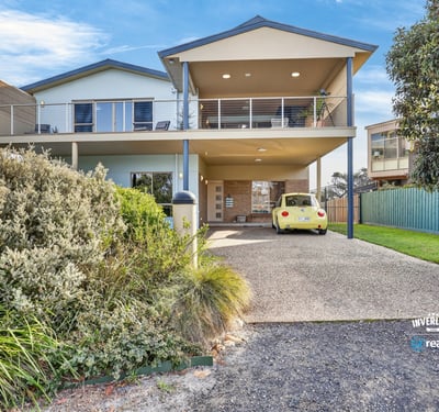 Spacious two-story home featuring expansive outdoor areas and modern amenities, perfect for entertaining or relaxing.