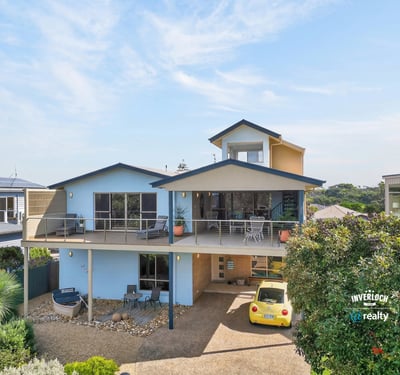 Contemporary coastal home featuring expansive outdoor spaces and panoramic views, perfect for relaxation and entertaining.