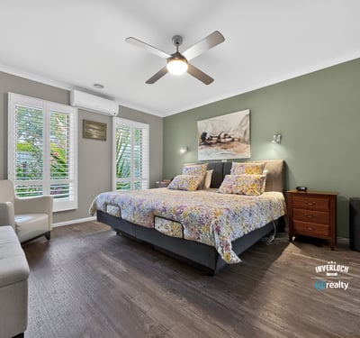 Bright and inviting bedroom featuring modern amenities and a tranquil view, perfect for relaxation.