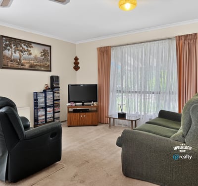 Bright and inviting living area featuring ample natural light and a welcoming atmosphere for relaxation.