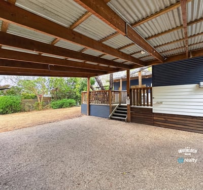 Spacious covered outdoor area perfect for gatherings and enjoying the surrounding natural landscape.