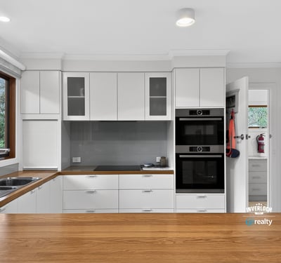 Modern kitchen with sleek cabinetry, high-quality appliances, and ample natural light creating an inviting atmosphere.