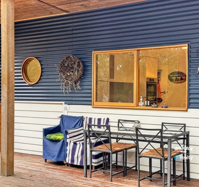 Enjoy outdoor living on this inviting patio, perfect for relaxed gatherings and morning coffee.