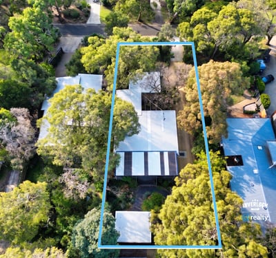 Spacious property surrounded by lush greenery, perfect for those seeking tranquility and ample outdoor space.