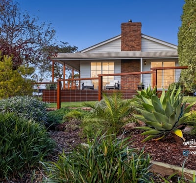 Discover a stunning home with expansive outdoor spaces and picturesque landscaping, perfect for relaxing or entertaining.