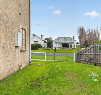 This property offers a spacious side yard with easy access to the street and neighboring homes.
