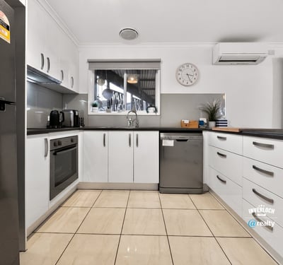 Modern kitchen featuring ample storage, stainless steel appliances, and a spacious layout for culinary creativity.