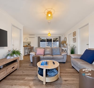 Spacious living area featuring modern amenities and abundant natural light, perfect for relaxation and entertaining.