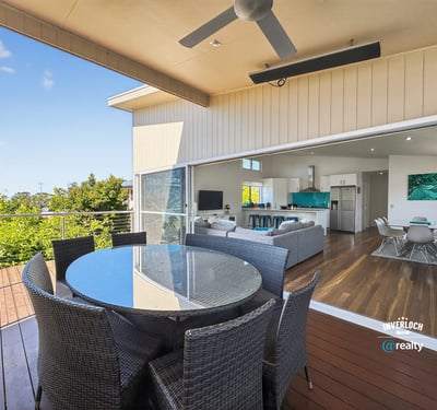 Experience seamless indoor-outdoor living with this inviting patio and expansive views of the surrounding greenery.