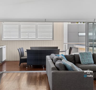 Bright and spacious living area seamlessly connects to a private outdoor space, perfect for relaxation.
