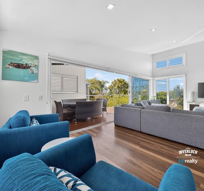 Modern open-concept living space featuring ocean views, ideal for entertaining and relaxation.