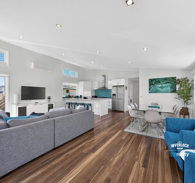 Modern open-concept living space with natural light, sleek design, and inviting atmosphere for family gatherings.