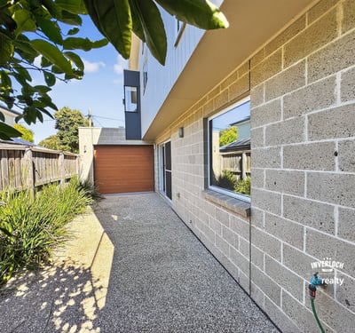 Contemporary home featuring a unique façade, private driveway, and landscaped outdoor space. Perfect for modern living.