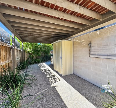 Discover a private outdoor space featuring ample shade, perfect for relaxation or entertaining.