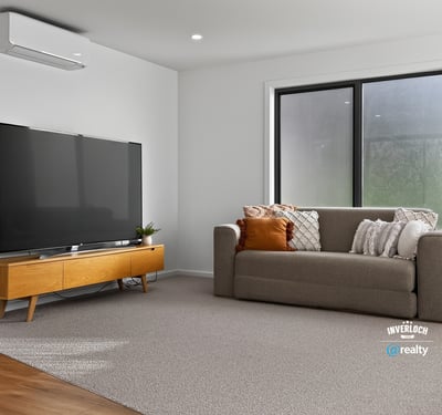 Bright and spacious living area featuring modern furnishings and large windows for ample natural light.